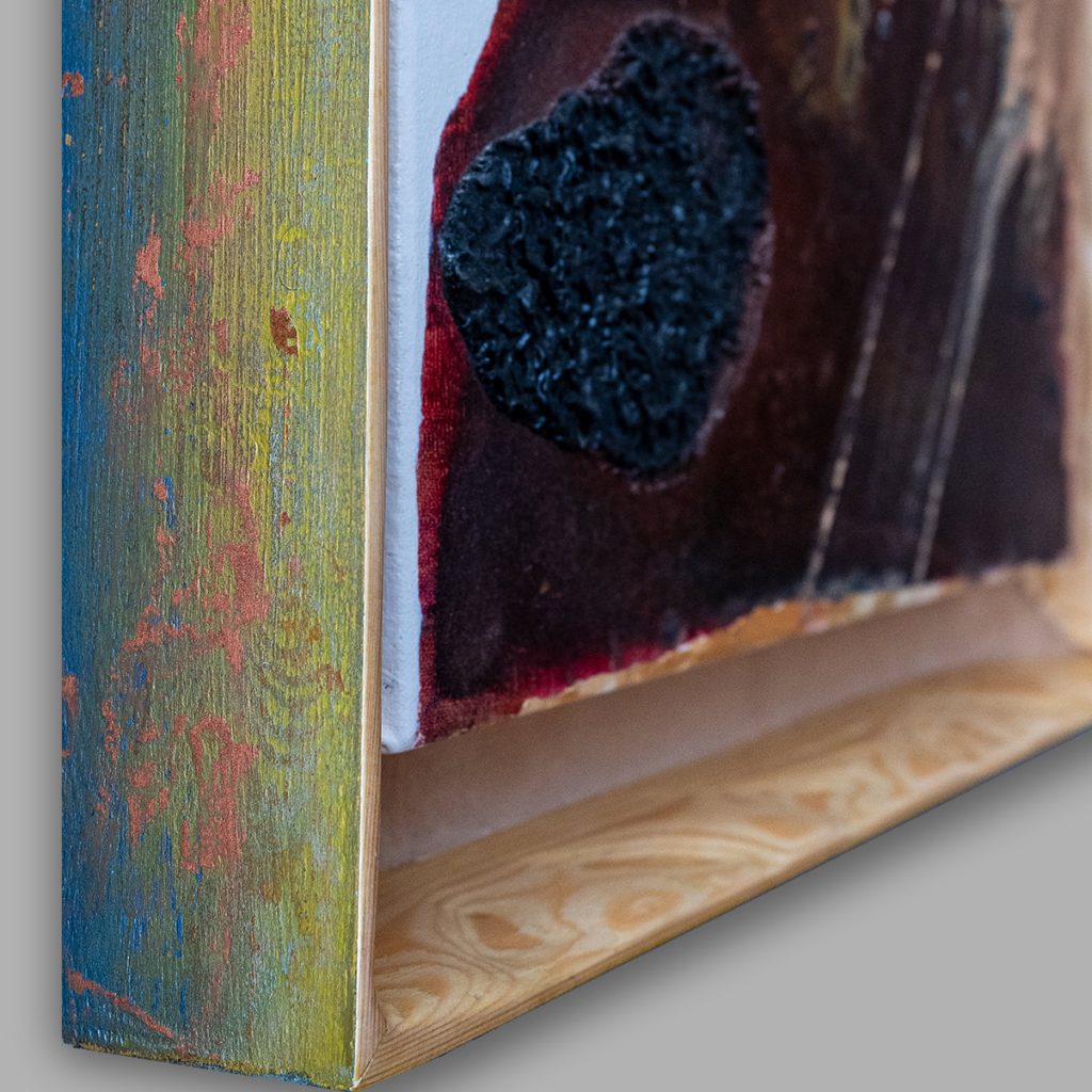 Exterior side of the bespoke wooden frame for Tethys – When the Sahara Was Sea, painted in layered green, blue, and red over pine.
