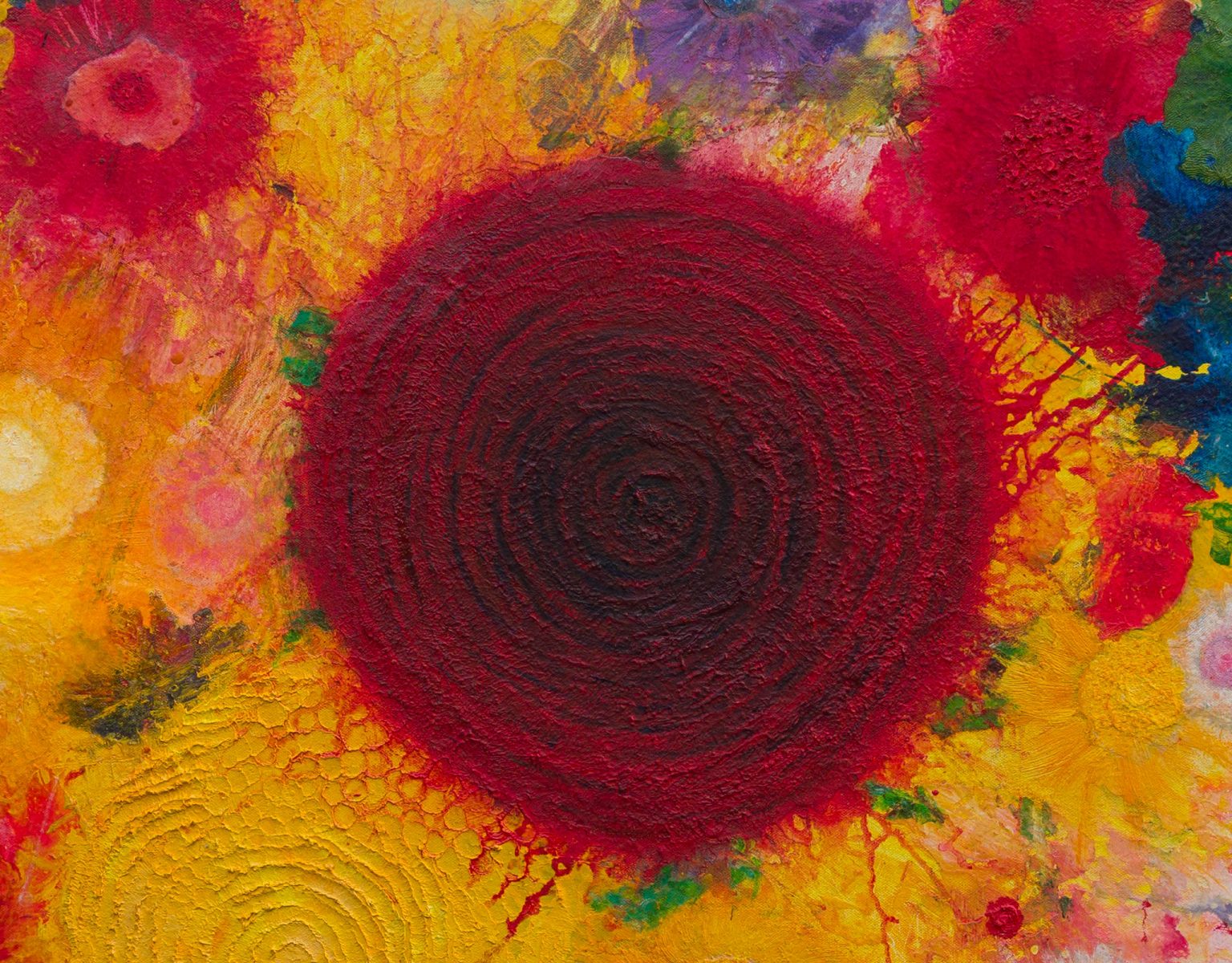 Wide detail showing the deep-red concentric disc surrounded by yellow, pink, blue, green and red forms.
